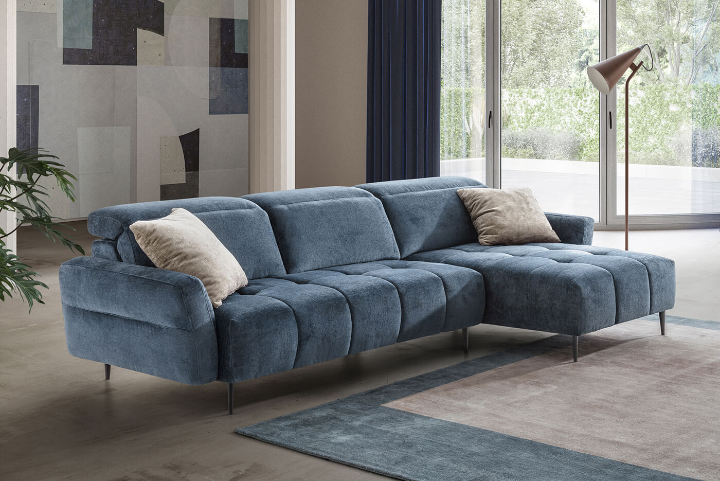 Divano blu con penisola trapuntato